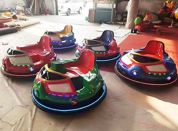 Electric bumper cars on production line with colorful designs