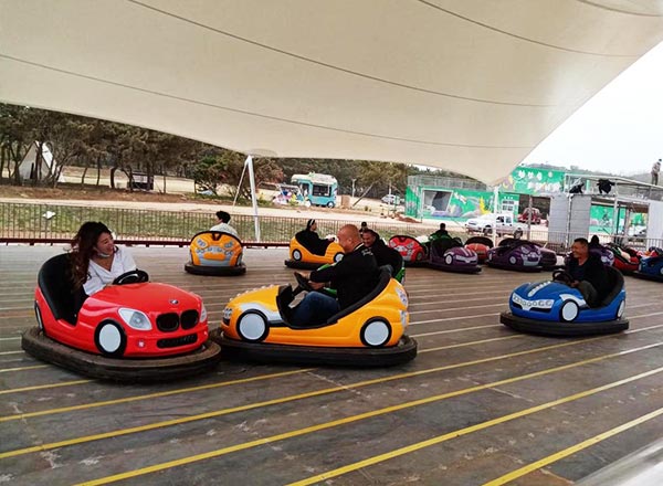 Outdoor bumper cars ride attracting families and mixed age groups